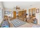Relaxing sunroom filled with natural light featuring tiled floors, and comfortable seating at 301 Gulf Dr, Venice, FL 34285