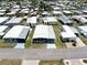Expansive aerial shot showcases the home within a vibrant community, highlighting its location and neighborhood appeal at 304 Roma Rd, Venice, FL 34285