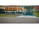 Exterior of a home with a covered parking area and well-maintained landscaping at 304 Roma Rd, Venice, FL 34285