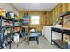 Utility room with a washer and dryer, shelving, and workbench area at 304 Roma Rd, Venice, FL 34285