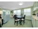 The bright and open living area includes a ceiling fan and blends with the dining area at 304 Roma Rd, Venice, FL 34285