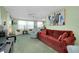Living area showcasing an open floor plan with comfortable seating, blending retro with contemporary style at 304 Roma Rd, Venice, FL 34285