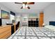 A main bedroom with wooden furnishings, carpet, and a connected bathroom at 304 Roma Rd, Venice, FL 34285