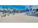 Community pool area with picnic tables and lounge chairs at 304 Roma Rd, Venice, FL 34285