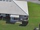 A sunny backyard featuring a brick patio and a well-maintained lawn, perfect for outdoor enjoyment and relaxation at 3141 Heron Shores Dr, Venice, FL 34293