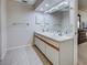 Well-lit bathroom featuring double sinks, tile flooring, and ample counter space in a clean, functional design at 3141 Heron Shores Dr, Venice, FL 34293