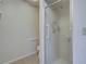Bathroom featuring a glass-enclosed shower and grab bars for safety and accessibility at 3141 Heron Shores Dr, Venice, FL 34293
