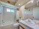 Clean bathroom with a tub, shower, single vanity, and marine-themed decorations, offering a functional space at 3141 Heron Shores Dr, Venice, FL 34293