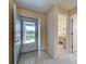 Bright foyer with tiled floor and a glimpse of the bedroom, creating a welcoming entry at 3141 Heron Shores Dr, Venice, FL 34293