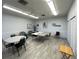 Community game room featuring wood floors, tables and chairs and a ceiling fan at 3141 Heron Shores Dr, Venice, FL 34293