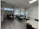 Bright game room featuring tables, chairs, and natural light from large windows at 3141 Heron Shores Dr, Venice, FL 34293