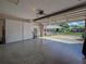 Spacious garage with built-in white cabinets for storage and a view of the neighborhood at 3141 Heron Shores Dr, Venice, FL 34293