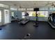 Well-equipped gym area with treadmills, bikes, and plenty of natural light at 3141 Heron Shores Dr, Venice, FL 34293