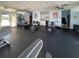 Spacious gym with exercise machines, weights, and mirrored walls at 3141 Heron Shores Dr, Venice, FL 34293