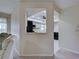 Hallway view into kitchen, showcasing the pass-through window at 3141 Heron Shores Dr, Venice, FL 34293