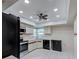 The kitchen features white cabinets, tile flooring, and modern appliances at 3141 Heron Shores Dr, Venice, FL 34293