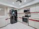 Bright kitchen with stainless steel appliances and plenty of cabinet storage at 3141 Heron Shores Dr, Venice, FL 34293
