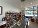Bright community library filled with books and natural light, perfect for reading and quiet contemplation at 3141 Heron Shores Dr, Venice, FL 34293