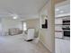 Bright living room that offers a view to an adjacent kitchen with white cabinetry at 3141 Heron Shores Dr, Venice, FL 34293