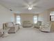 Spacious living room with carpet flooring, neutral walls, and natural light at 3141 Heron Shores Dr, Venice, FL 34293