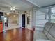 Sunroom with tile floors, neutral couch, and view into other rooms at 3141 Heron Shores Dr, Venice, FL 34293
