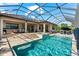 The beautiful screened-in pool and spa sit just off the covered patio, creating the perfect outdoor entertaining space at 329 Myrtle Ave, Nokomis, FL 34275