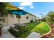 Enjoy the outdoors with a picnic table and putting green, creating a perfect backyard retreat at 329 Myrtle Ave, Nokomis, FL 34275