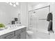 Bathroom featuring a shower with glass door, gray cabinets, and white marble floor at 329 Myrtle Ave, Nokomis, FL 34275