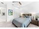 Bedroom featuring a queen bed, carpeted floors, and two large nightstands at 329 Myrtle Ave, Nokomis, FL 34275