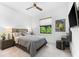 Comfortable bedroom featuring a queen bed, neutral tones, and natural light at 329 Myrtle Ave, Nokomis, FL 34275
