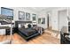 Bedroom with wood floors, a large bed, exercise equipment, and ensuite entrance at 329 Myrtle Ave, Nokomis, FL 34275