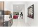 Bright foyer with marble floors leading to the living room, showcasing an open-concept design at 329 Myrtle Ave, Nokomis, FL 34275