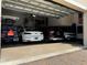 Spacious four-car garage with ample storage and parking for multiple vehicles and bicycles at 329 Myrtle Ave, Nokomis, FL 34275
