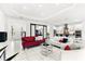Open-concept design integrates a living area, office, and kitchen with marble floors and modern decor at 329 Myrtle Ave, Nokomis, FL 34275