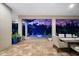 Covered patio featuring pavers and views of the screened-in pool and twilight sky at 329 Myrtle Ave, Nokomis, FL 34275