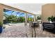 Lovely outdoor patio with beautiful brick pavers, dining area and gorgeous views of the pool and backyard at 329 Myrtle Ave, Nokomis, FL 34275