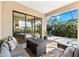Inviting outdoor patio and lanai overlooking the gorgeous pool and landscaping at 329 Myrtle Ave, Nokomis, FL 34275