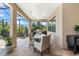 Comfortable outdoor dining space offering lovely pavers and a built-in outdoor grill for summer entertaining at 329 Myrtle Ave, Nokomis, FL 34275
