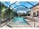 Relax in this gorgeous screened-in pool with a spa, all conveniently located off the home's covered patio at 329 Myrtle Ave, Nokomis, FL 34275