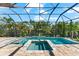 A screen-enclosed pool and spa provide a private and relaxing outdoor space at 329 Myrtle Ave, Nokomis, FL 34275