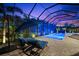 An inviting enclosed pool area with comfortable lounge chairs, ideal for relaxation and outdoor enjoyment at 329 Myrtle Ave, Nokomis, FL 34275