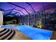 The screened in pool area features a spa, in-pool lighting, and outdoor seating at 329 Myrtle Ave, Nokomis, FL 34275