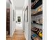 Well-organized walk-in closet featuring shelving and a variety of bags and shoes at 329 Myrtle Ave, Nokomis, FL 34275