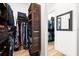 Bright and spacious walk-in closet with wood shelving and an organized hanging system at 329 Myrtle Ave, Nokomis, FL 34275