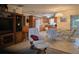Cozy living area flows into a bright kitchen and dining area, perfect for gatherings at 3311 Papaya Rd, Venice, FL 34293