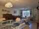 Inviting living room offers built-in bookshelves, a comfortable sofa, and a decorative stained-glass window at 3311 Papaya Rd, Venice, FL 34293