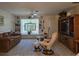 Spacious living room features a window seat, built-in bookshelves, and a large entertainment center at 3311 Papaya Rd, Venice, FL 34293