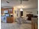 Kitchen features tile floor, pendant lighting, wood cabinetry and eat in dining area at 3311 Papaya Rd, Venice, FL 34293