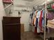Walk-in closet with wire shelving and hanging clothes at 3311 Papaya Rd, Venice, FL 34293