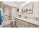 Bathroom featuring a vanity with drawers, bathtub with shower and a large framed mirror at 3382 Mermoor Dr # 3201, Palm Harbor, FL 34685